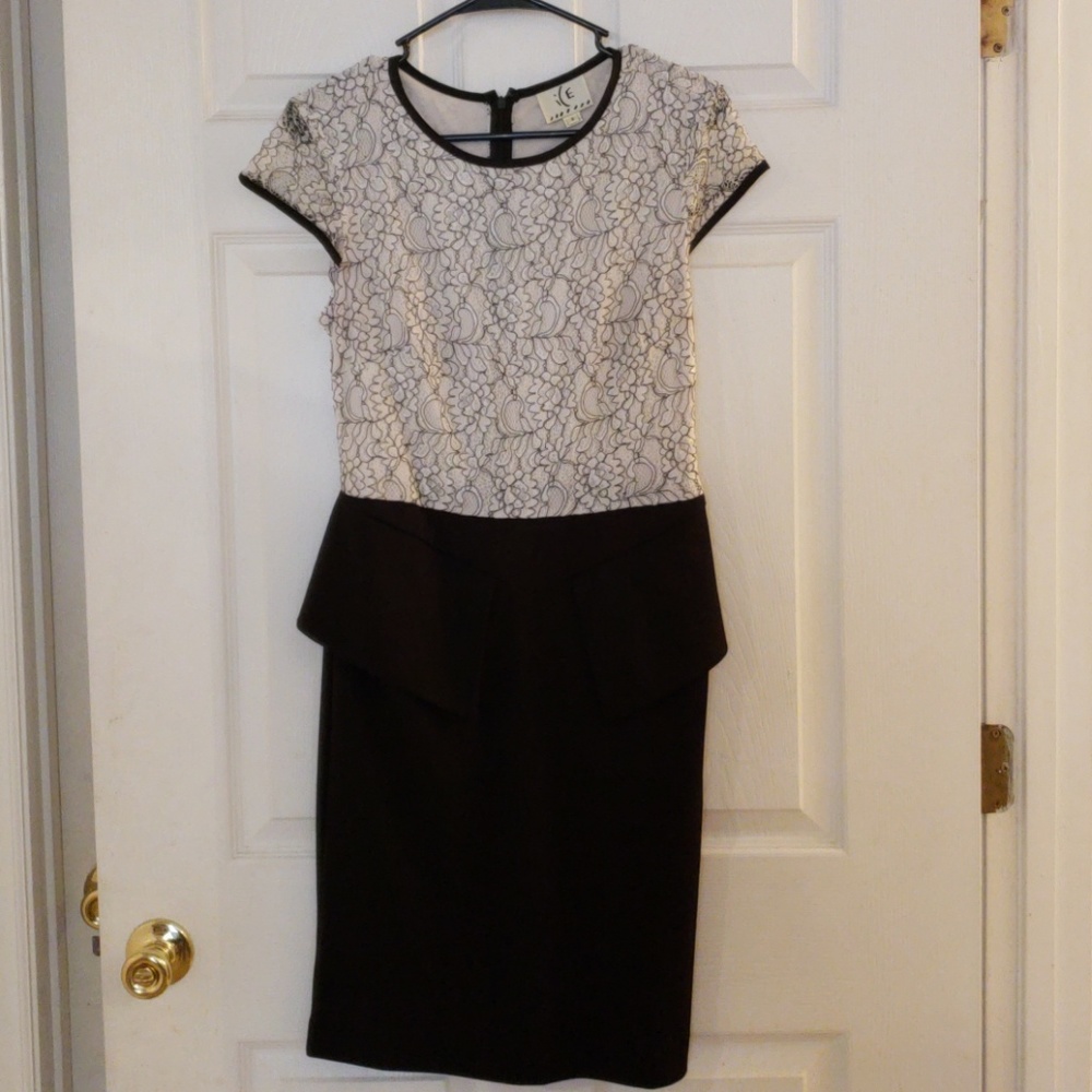 Black, gray and white peplum style dress